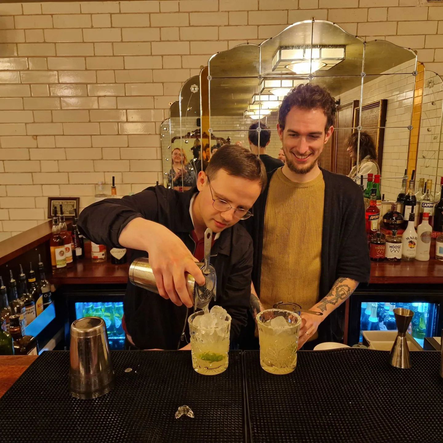 Team members making cocktails