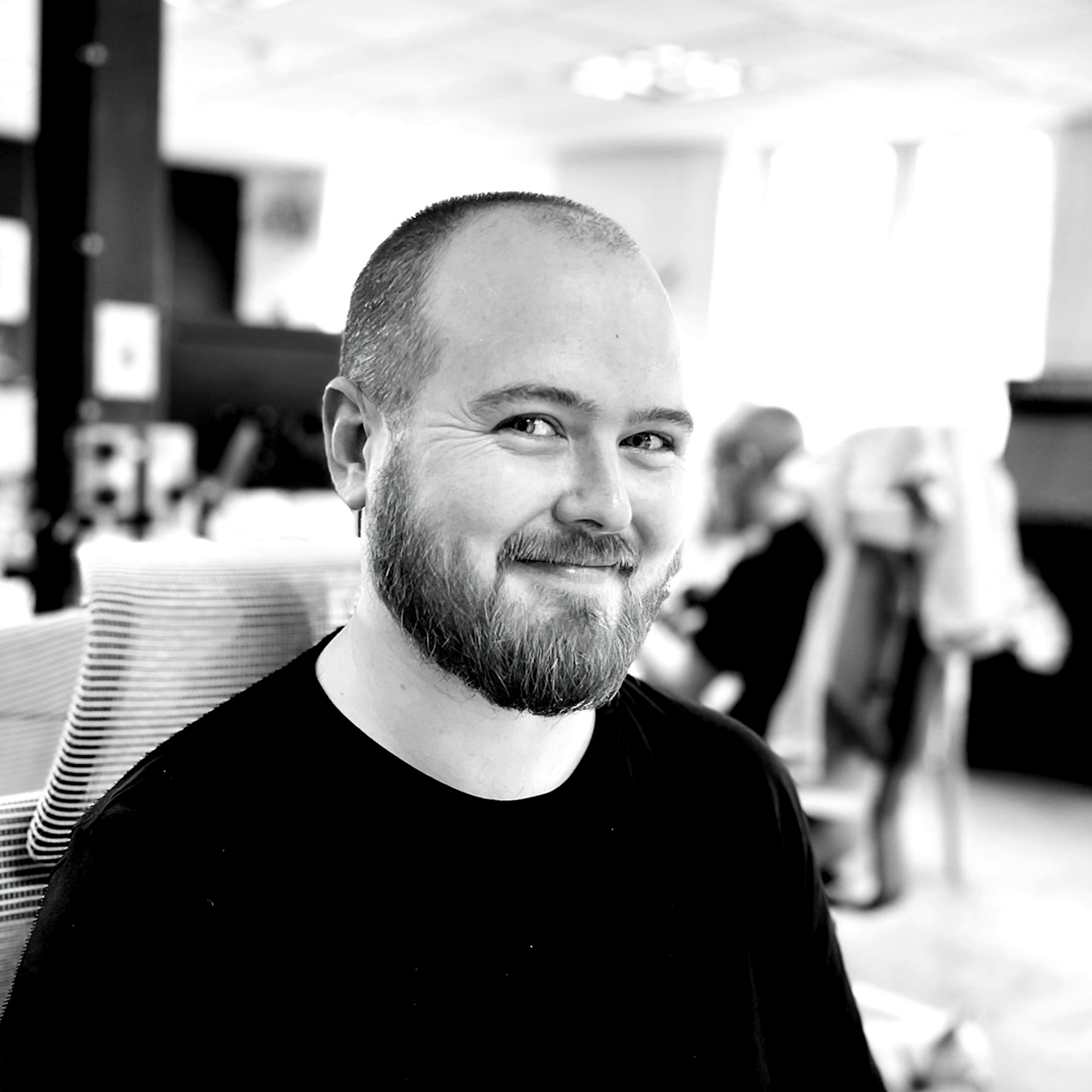 Brendan Bennett sitting at his desk