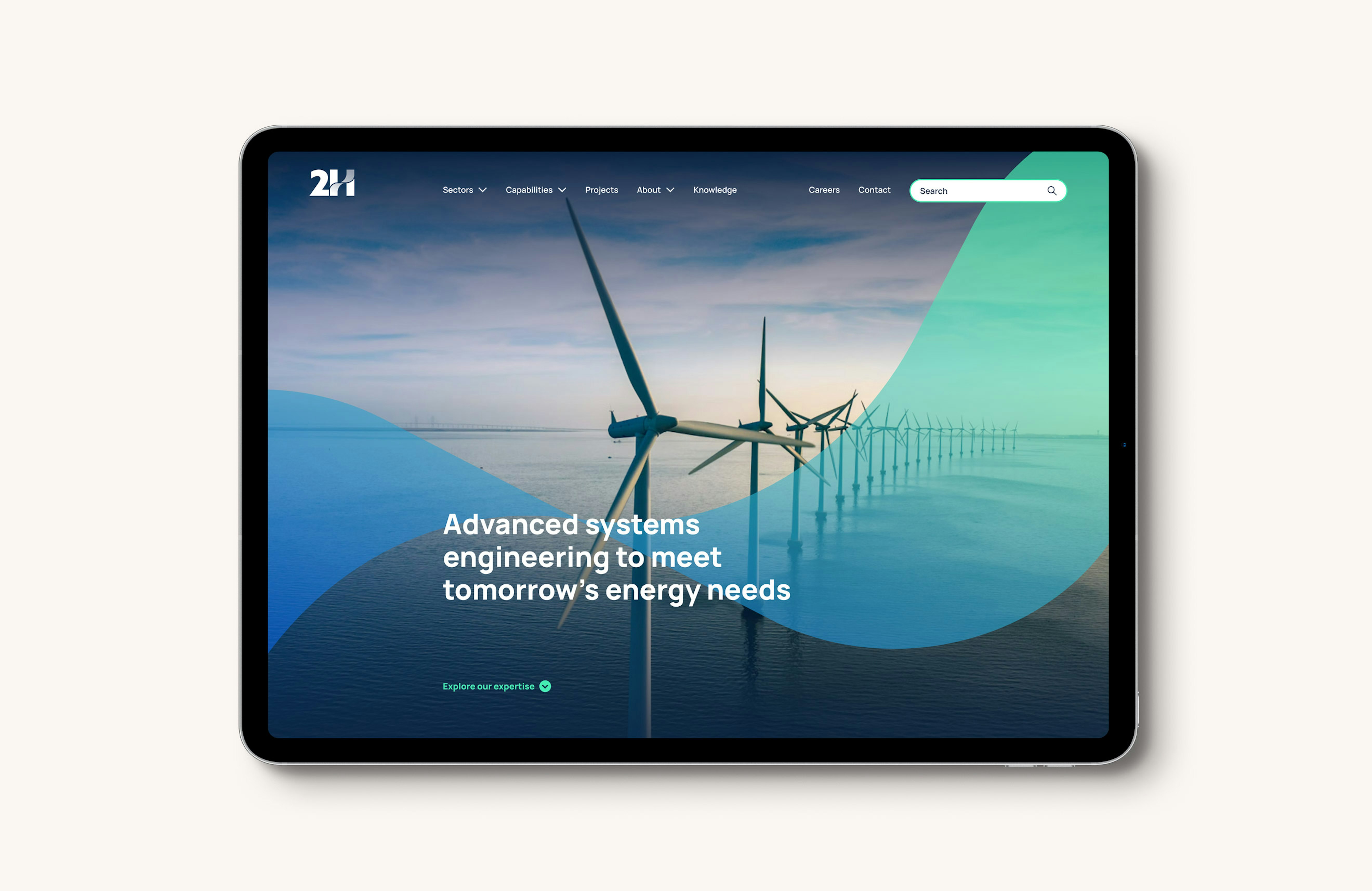 The hero section of the 2H website displayed on an Ipad tablet computer