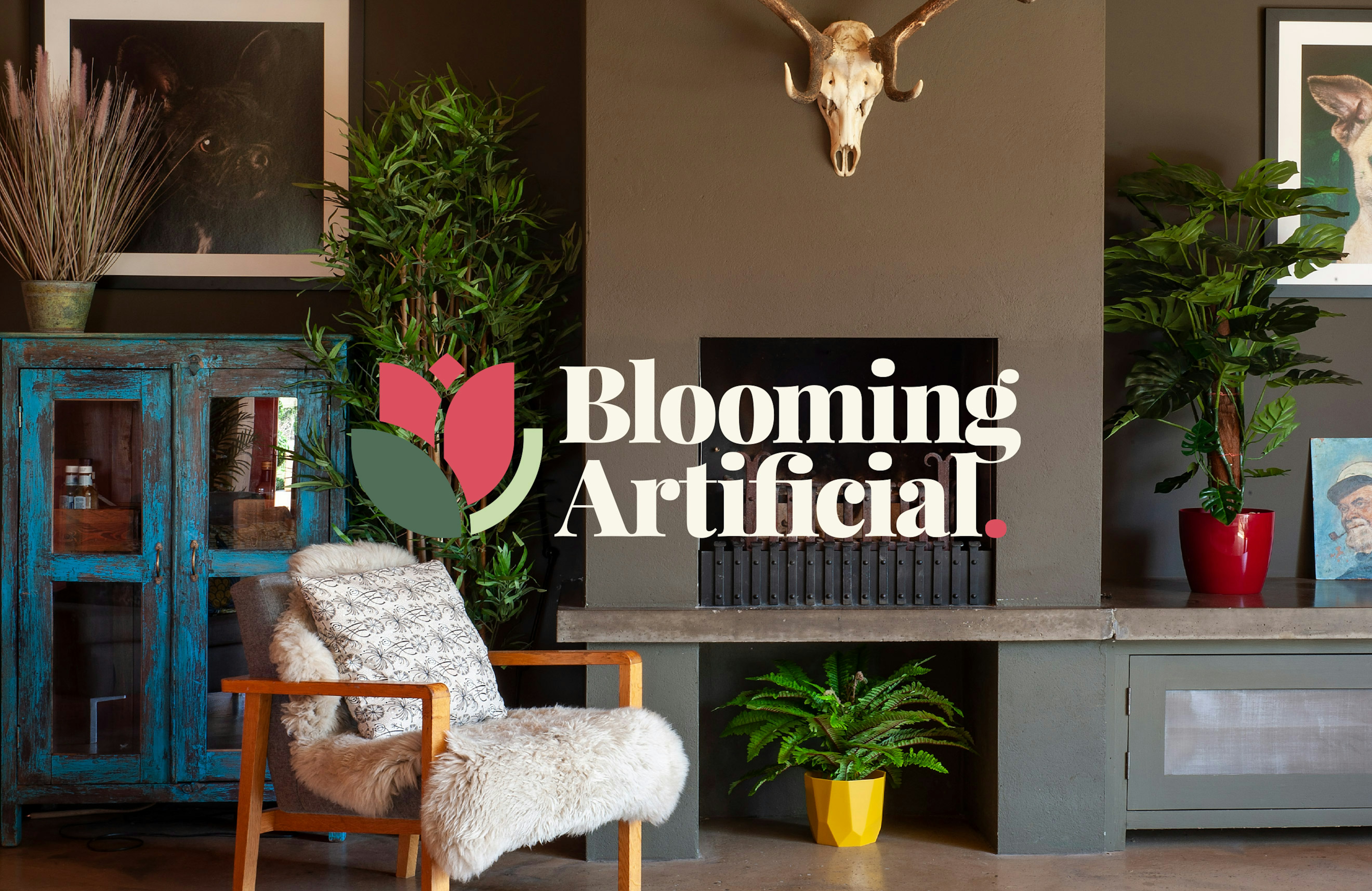 A stylish living room featuring artificial plants in colourful pots, a cosy fur-lined chair, and rustic decor, overlaid with the Blooming Artificial logo.