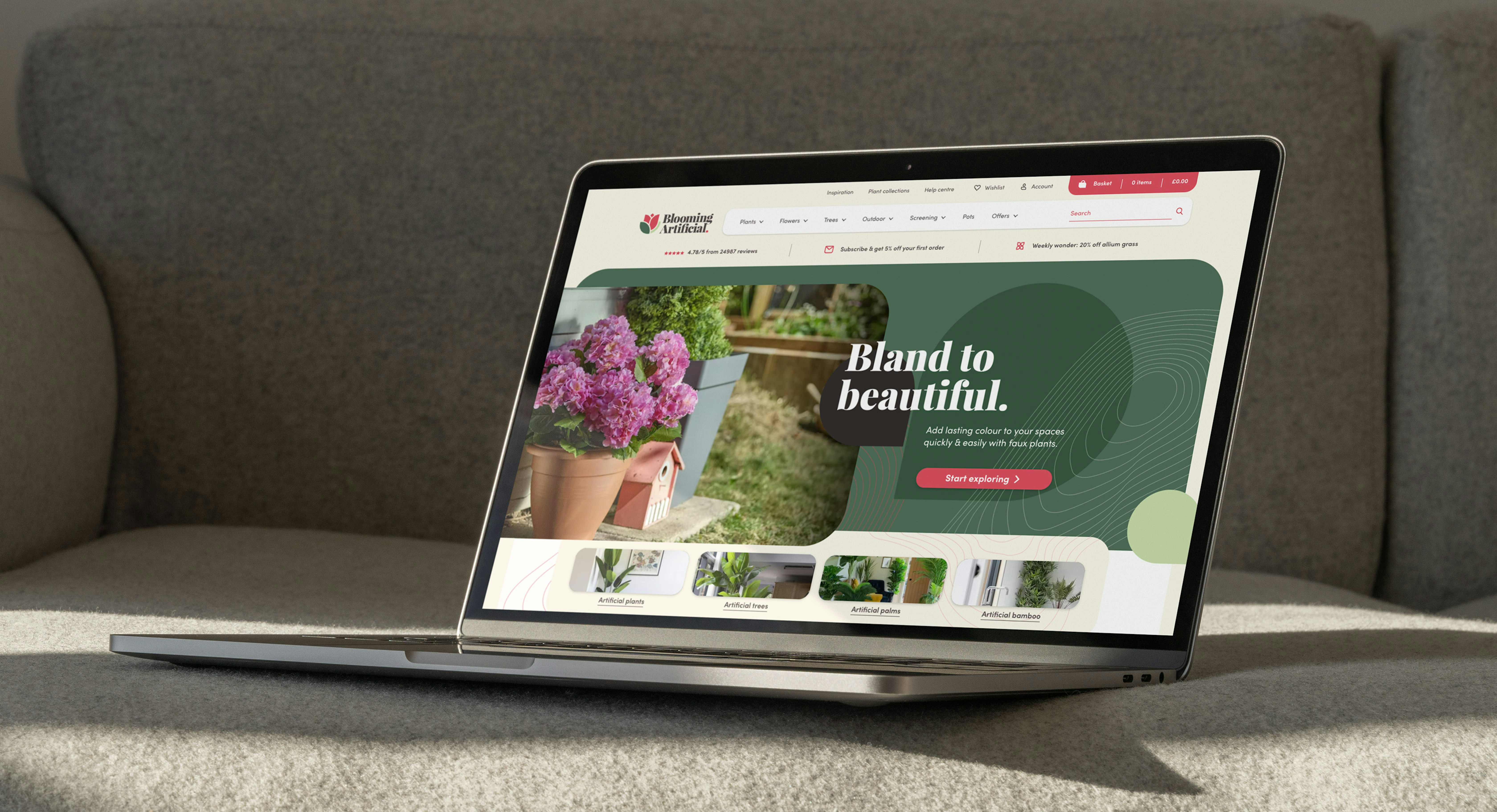 A laptop displaying the Blooming Artificial website, featuring a promotional banner for artificial plants with the slogan