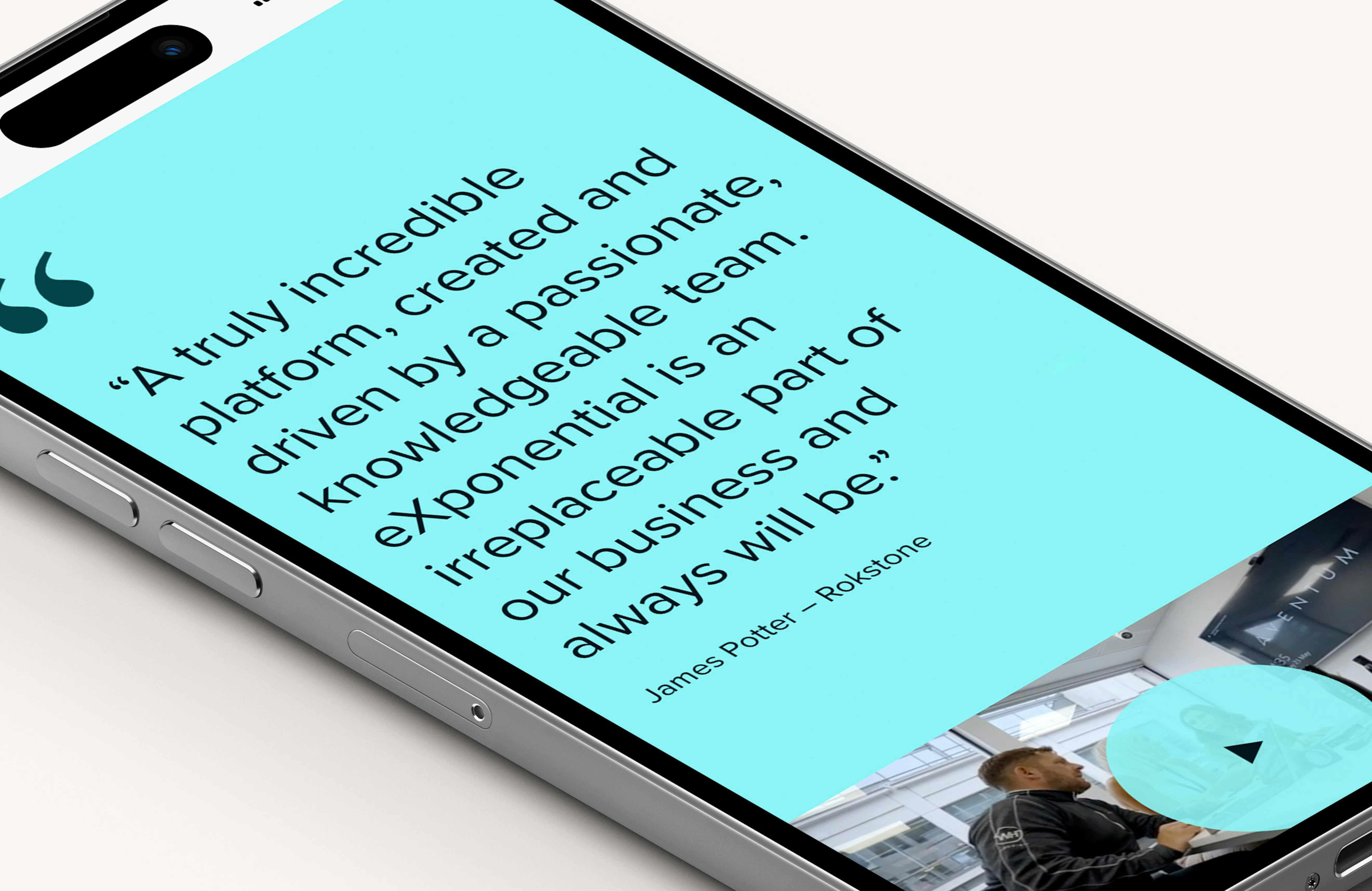 A mobile phone lying on flat on a surface displaying a testimonial panel on the Exponential website