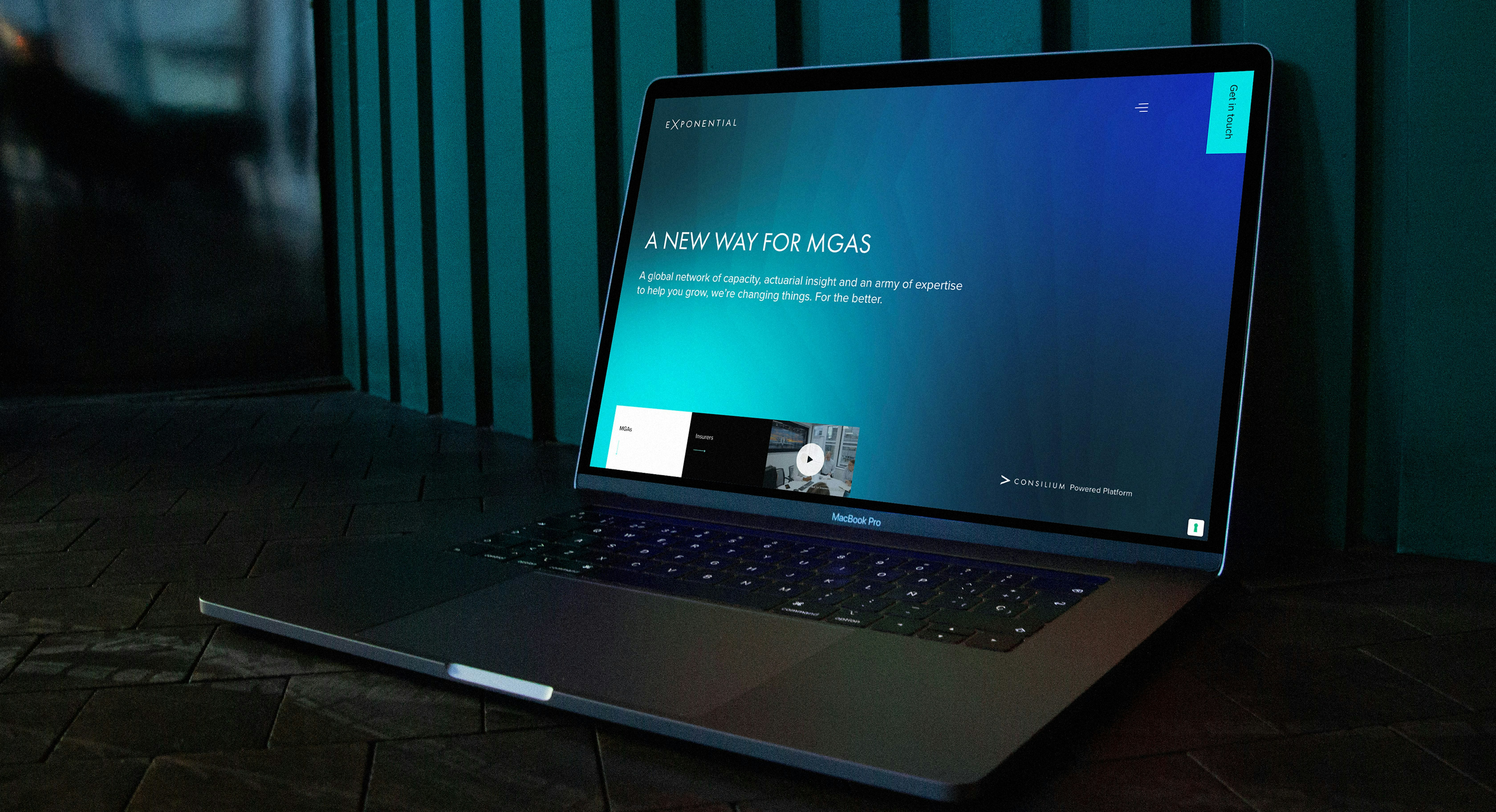 an open laptop displaying the Exponential website