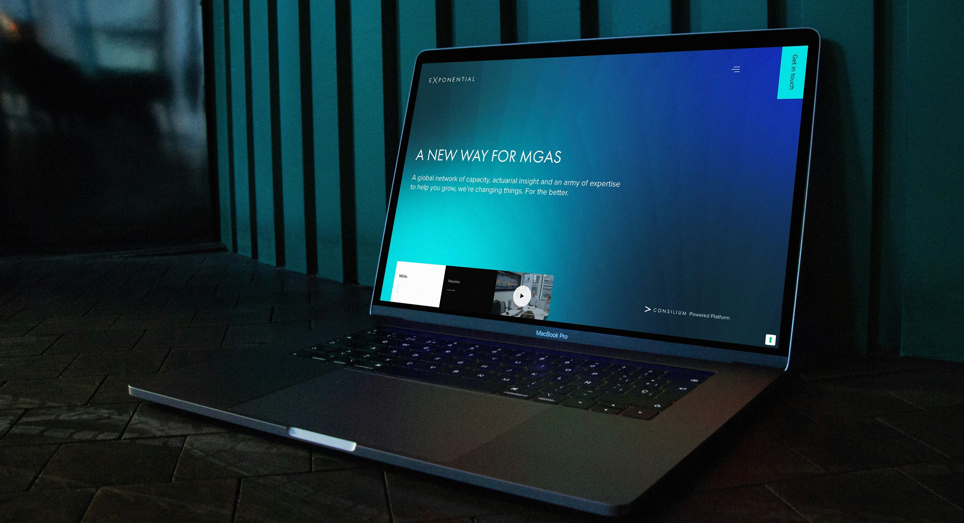 an open laptop displaying the Exponential website