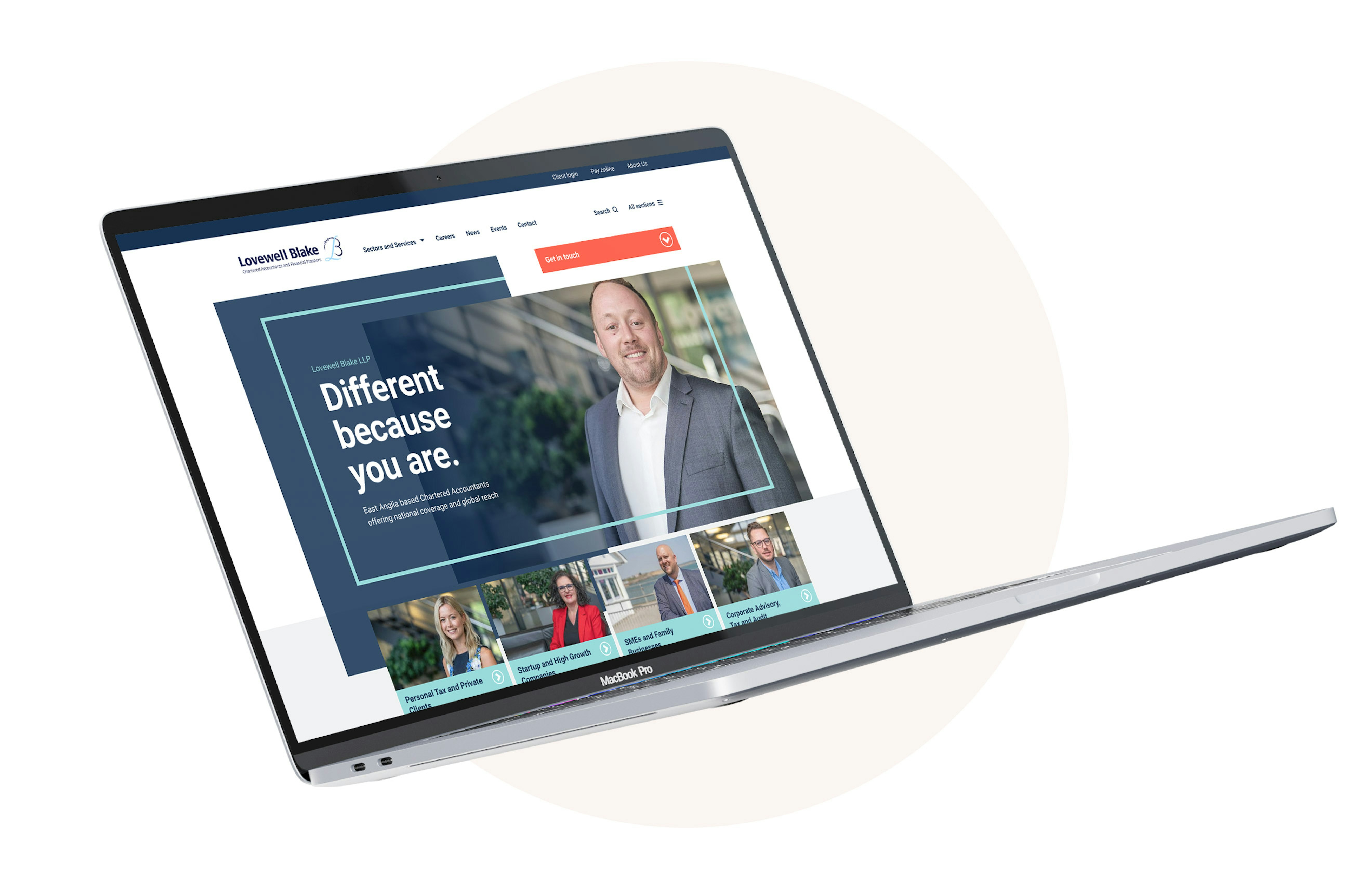 An open laptop computer displaying the homepage of the Lovewell Blake website