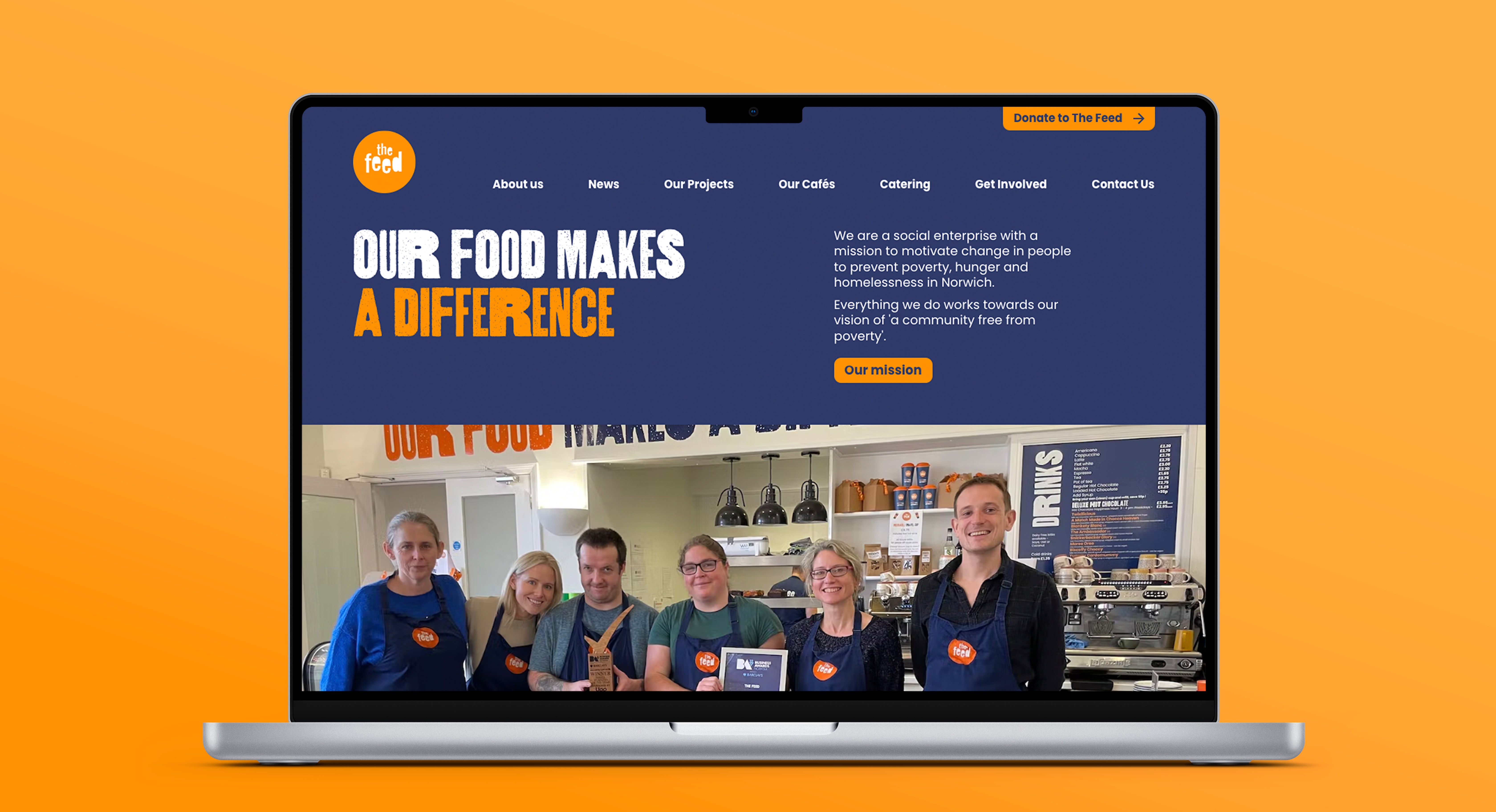 An open laptop displaying the homepage of the Feed website