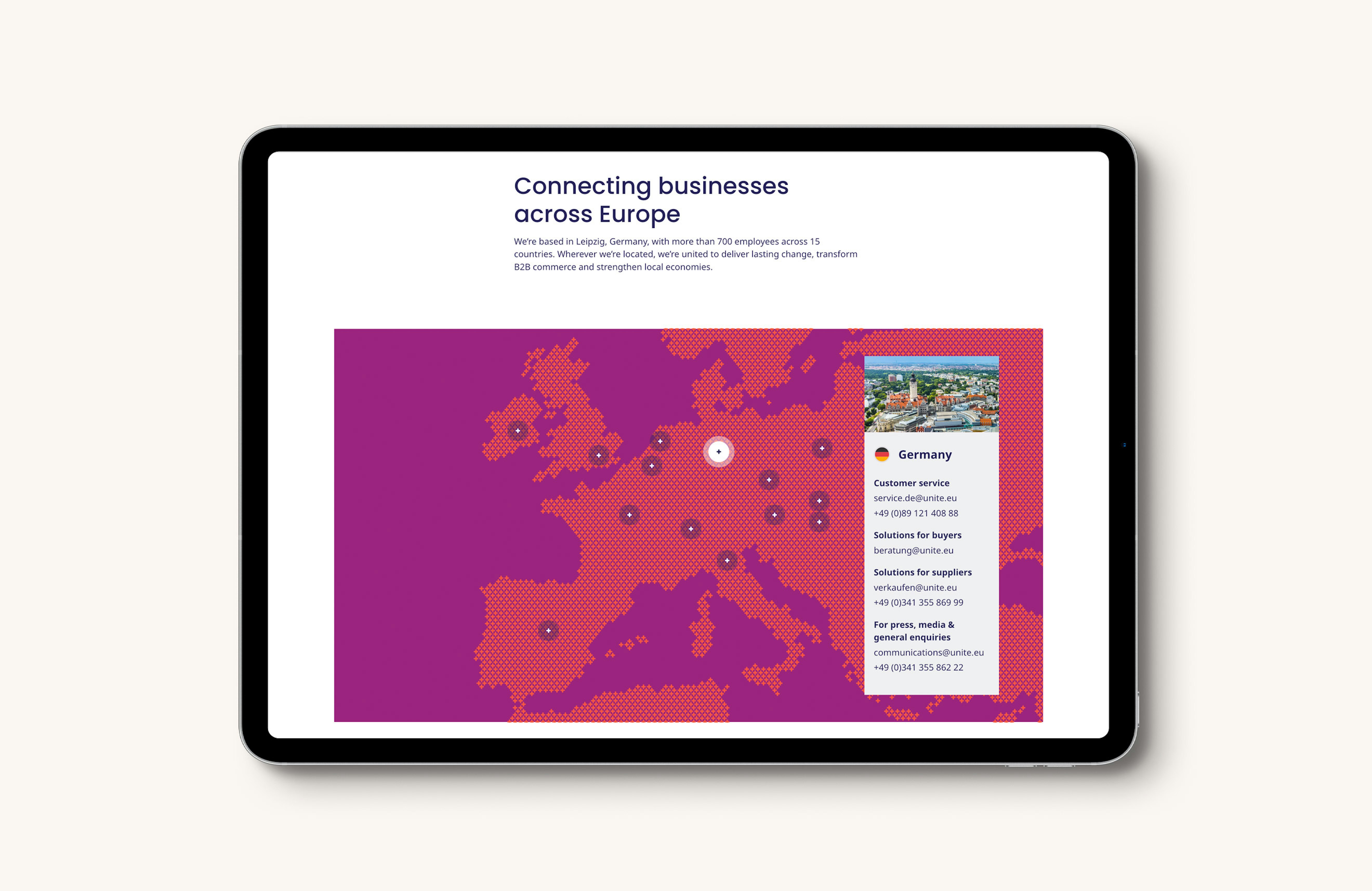 A tablet displaying the Unite website with a hexagonal map of Europe, highlighting business connections and contact details for Germany.