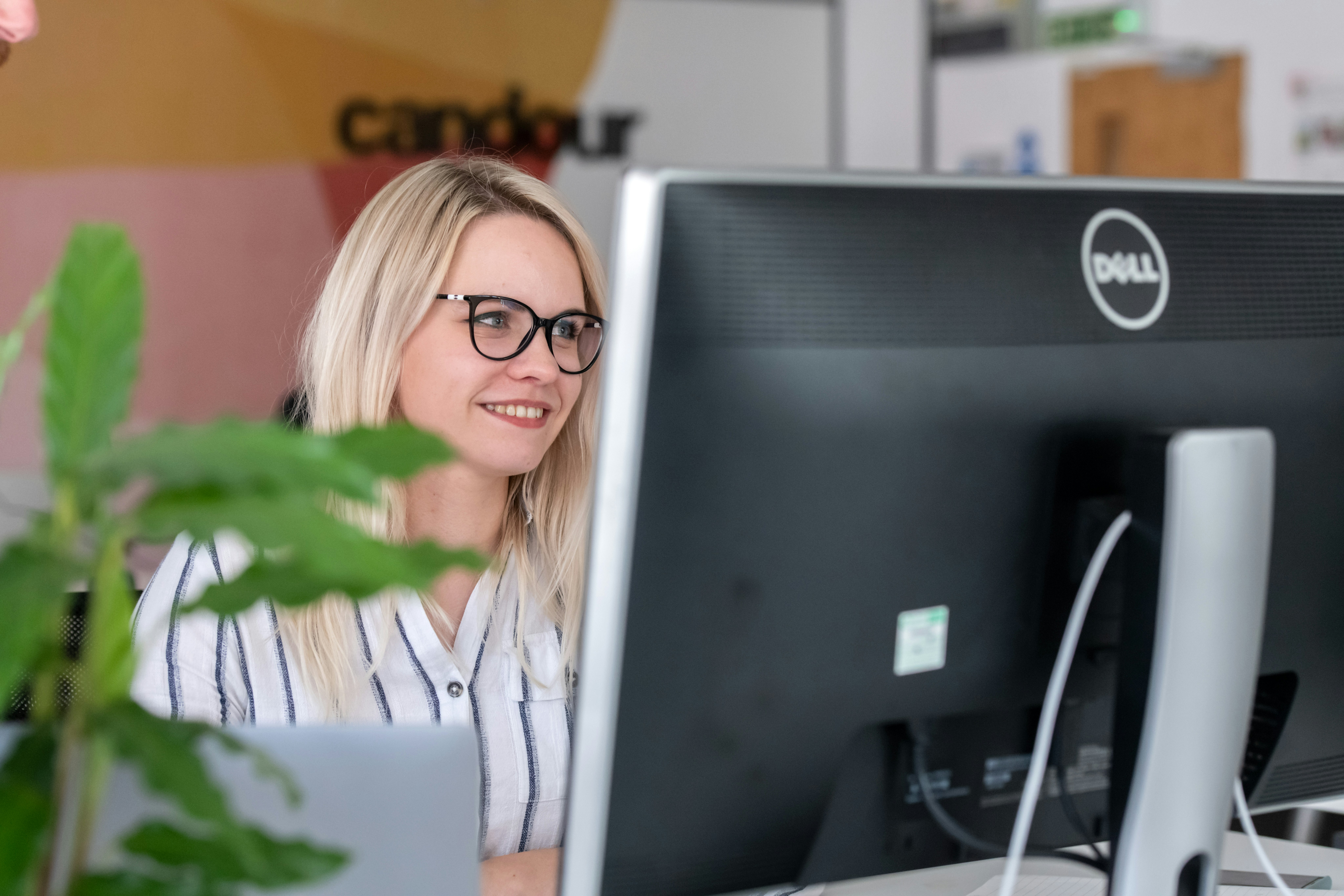 Kristiana working at her computer at Candour