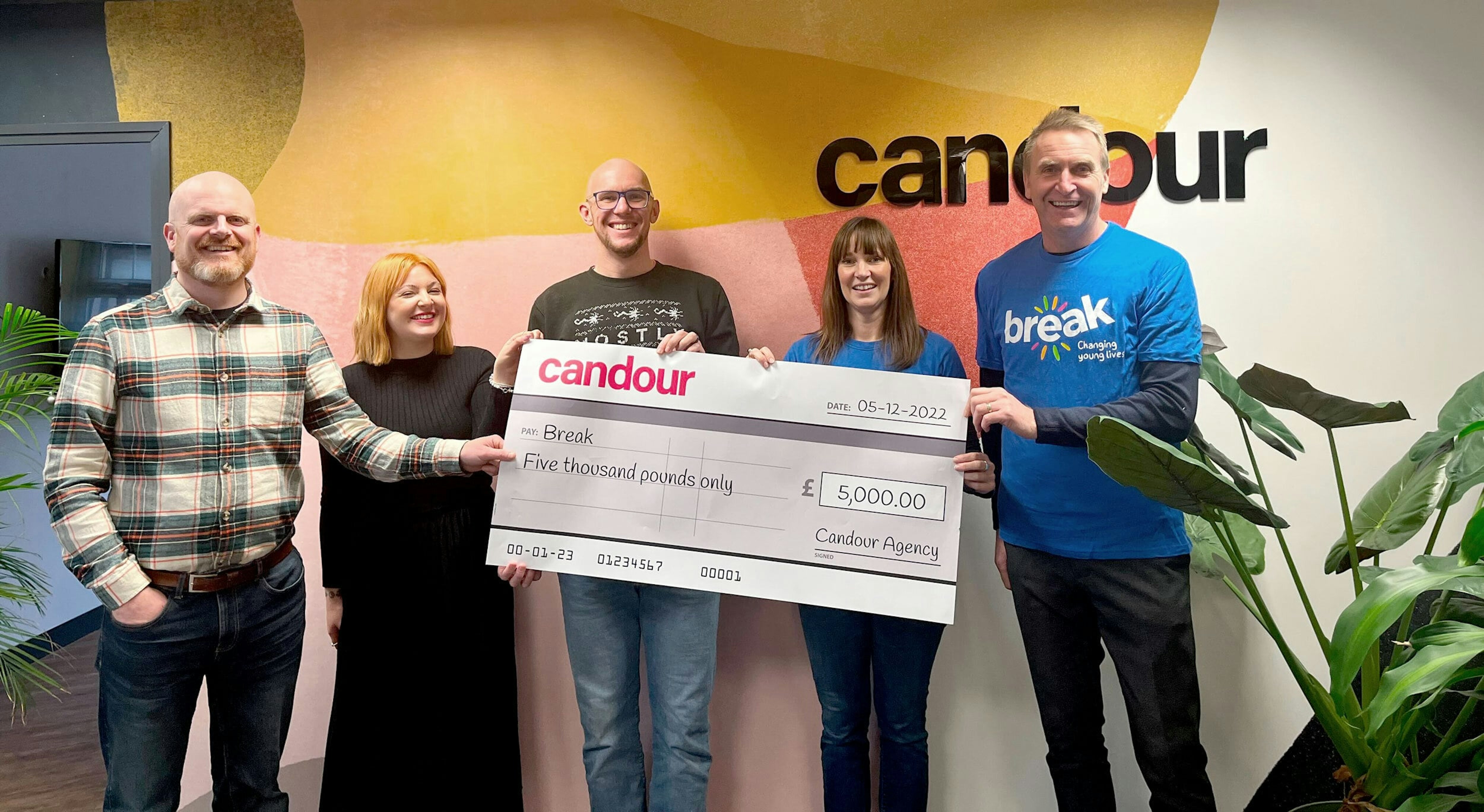 John, Jessica and Mark presenting a large cheque to Break representatives