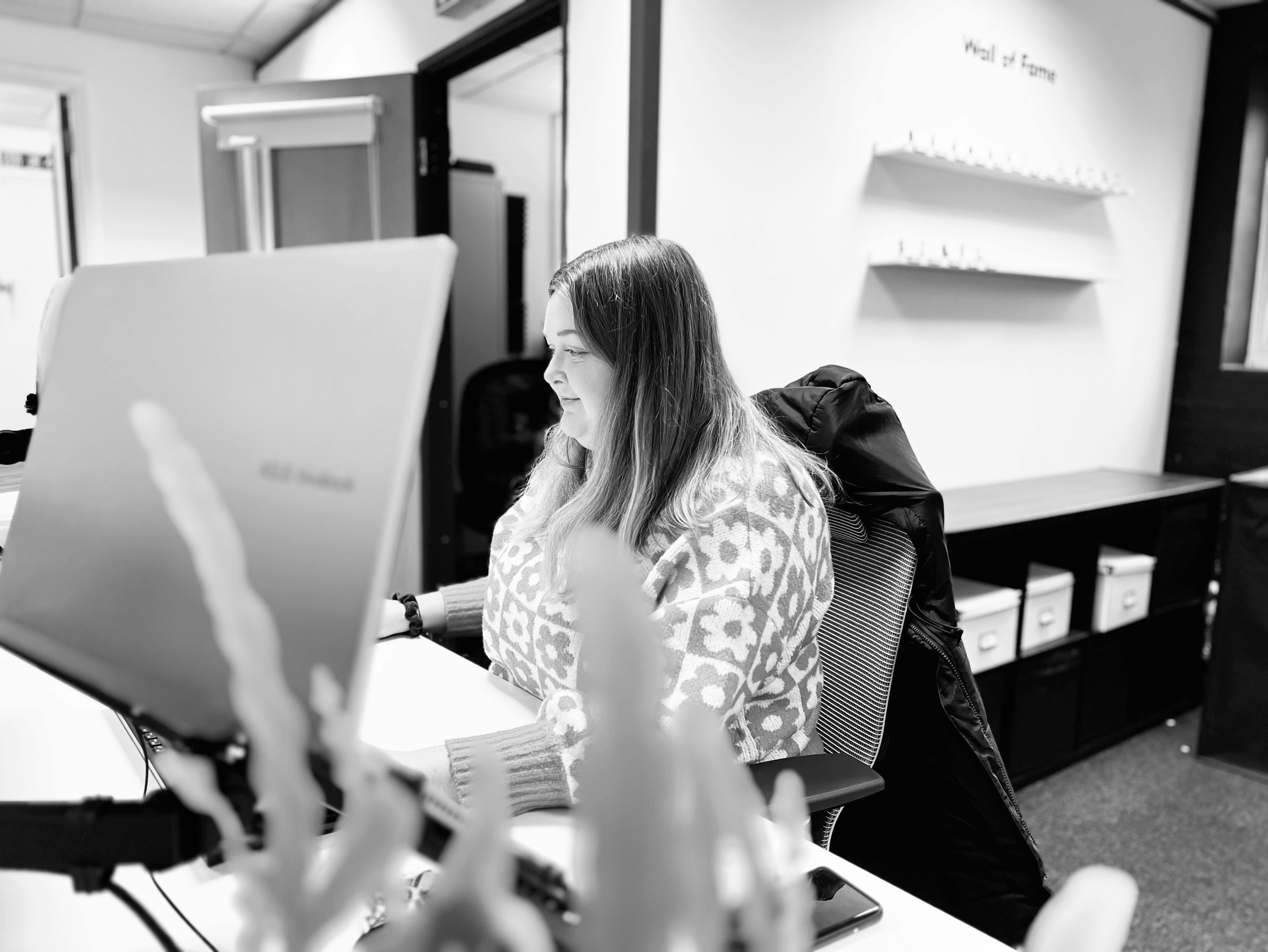 A Candour agency team member sitting that their desk working in the PR team