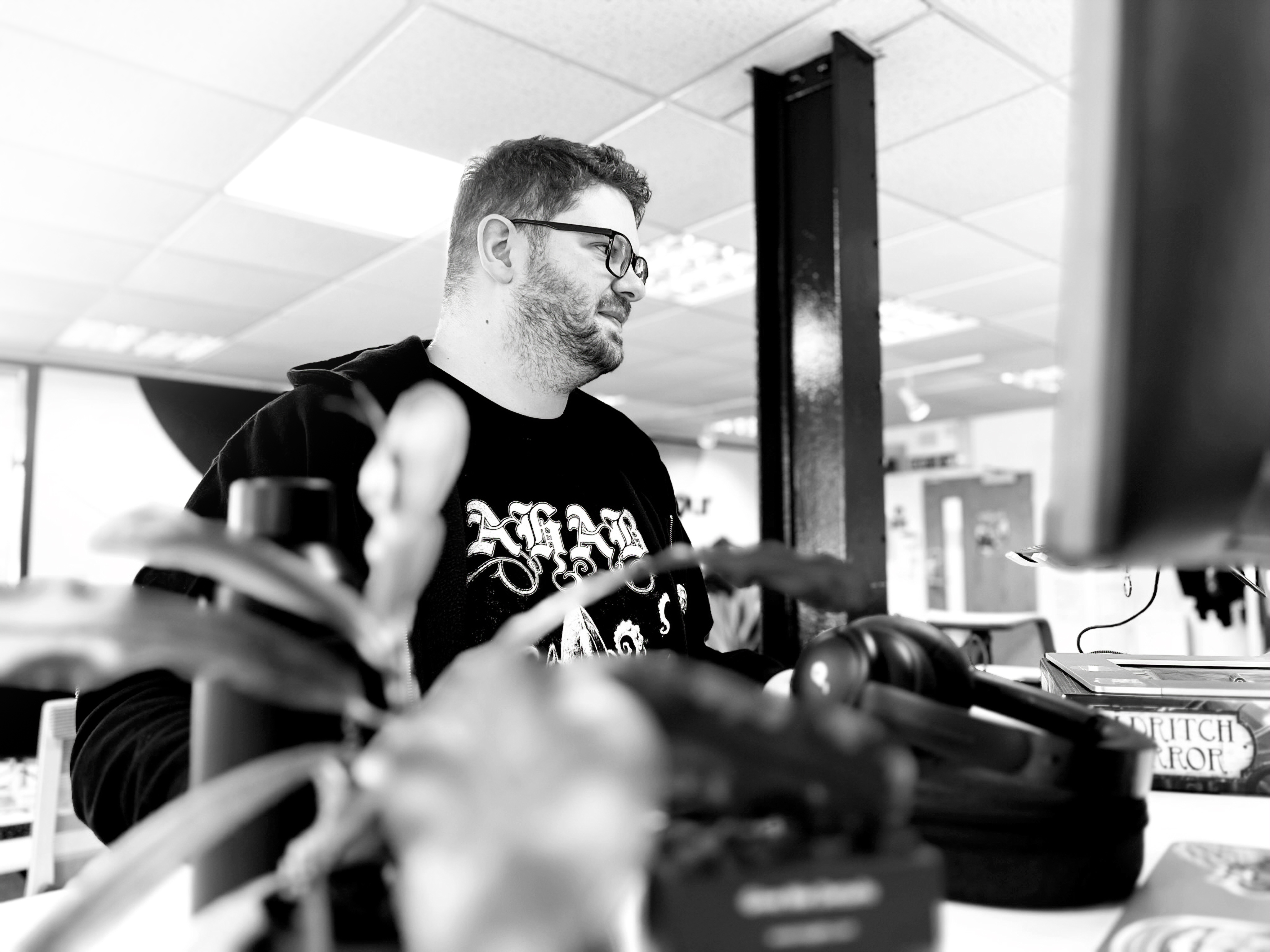 A Candour team member working at a standing desk